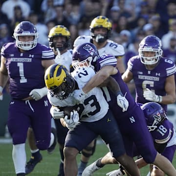 Nov 15, 2025; Chicago, Illinois, USA; Michigan Wolverines running back Jordan Marshall (23) runs against the Northwestern Wildcats during the second half at Wrigley Field. Mandatory Credit: David Banks-Imagn Images