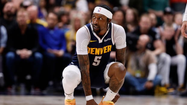 Apr 29, 2024; Denver, Colorado, USA; Denver Nuggets guard Kentavious Caldwell-Pope (5) holds his ankle in the third quarter against the Los Angeles Lakers during game five of the first round for the 2024 NBA playoffs at Ball Arena. Mandatory Credit: Isaiah J. Downing-USA TODAY Sports