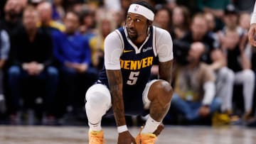 Apr 29, 2024; Denver, Colorado, USA; Denver Nuggets guard Kentavious Caldwell-Pope (5) holds his ankle in the third quarter against the Los Angeles Lakers during game five of the first round for the 2024 NBA playoffs at Ball Arena. Mandatory Credit: Isaiah J. Downing-USA TODAY Sports