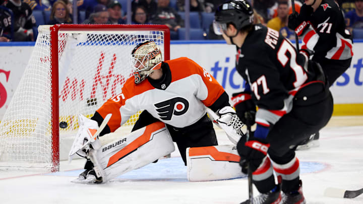 Apr 17, 2025; Buffalo, New York, USA;  Buffalo Sabres right wing JJ Peterka (77) scores a goal on Philadelphia Flyers goaltender Aleksei Kolosov (35) during the second period at KeyBank Center. Mandatory Credit: Timothy T. Ludwig-Imagn Images