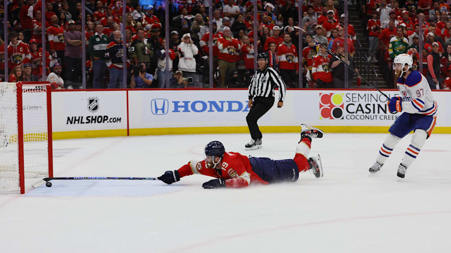 Florida Panthers forward Matthew Tkachuk reaches for the puck on an empty net attempt on goal by Edmonton Oilers forward Connor McDavid during the 2024 Stanley Cup Final | Sam Navarro-Imagn Images