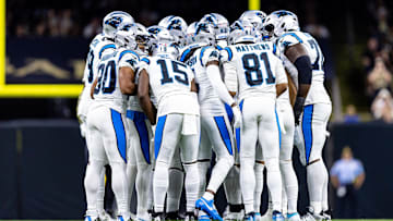 Sep 8, 2024; New Orleans, Louisiana, USA;  Carolina Panthers quarterback Bryce Young (9) calls a play in the huddle with wide receiver Jonathan Mingo (15) against the New Orleans Saints during the first half at Caesars Superdome. 