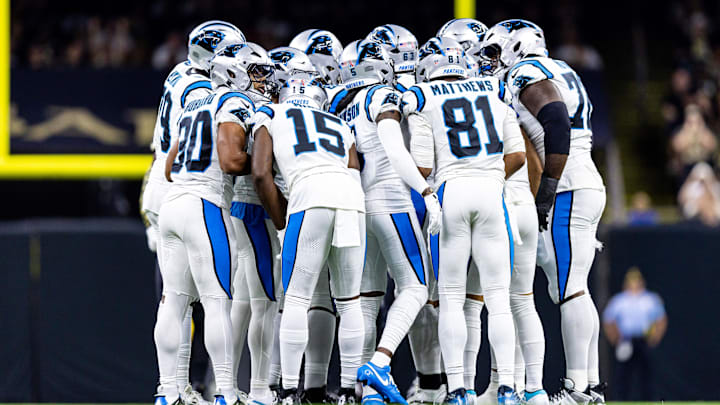 Sep 8, 2024; New Orleans, Louisiana, USA;  Carolina Panthers quarterback Bryce Young (9) calls a play in the huddle with wide receiver Jonathan Mingo (15) against the New Orleans Saints during the first half at Caesars Superdome. 