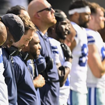 Dallas Cowboys quarterback Dak Prescott during the National Anthem before a game against the Chicago Bears at Soldier Field. 