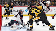 Mar 21, 2025; Pittsburgh, Pennsylvania, USA;  Columbus Blue Jackets goaltender Elvis Merzlikins (90) makes a save against Pittsburgh Penguins center Evgeni Malkin (71) during the third period at PPG Paints Arena. Mandatory Credit: Charles LeClaire-Imagn Images