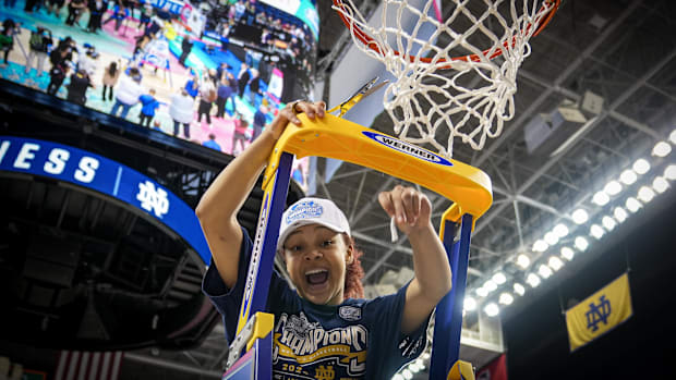 Hannah Hidalgo cuts down the net at the ACC Tournament in 2024 after a win over NC Stat