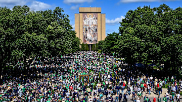 Sep 7, 2024; South Bend, Indiana, USA; Fans gather in front of the Word of Life mural, commonly known as Touchdown Jesus, before the game between the Notre Dame Fighting Irish and the Northern Illinois Huskies at Notre Dame Stadium. Mandatory Credit: Matt Cashore-Imagn Images