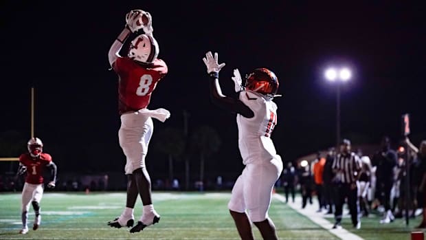 Immokalee DB Gilbert Charles (8) intercepts a pass against Lely. Charles also scored three touchdowns in the win.