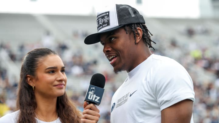 Former Penn State receiver Jahan Dotson is interviewed on the sideline at the 2023 Blue-White Game at Beaver Stadium.