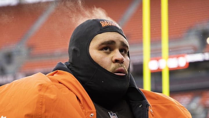 Dec 24, 2022; Cleveland, Ohio, USA; Steam comes off the head of Cleveland Browns offensive tackle Jedrick Wills Jr. (71) as he walks off the field following the game against the New Orleans Saints at FirstEnergy Stadium. Mandatory Credit: Scott Galvin-Imagn Images