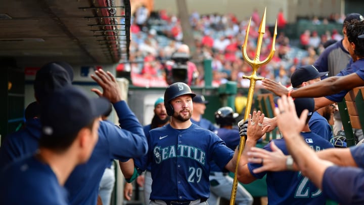 Seattle Mariners catcher Cal Raleigh is greeted after hitting a solo home run against the Los Angeles Angels on Thursday at Angel Stadium.