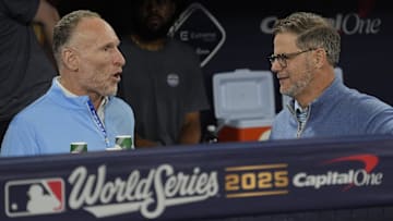 Toronto Blue Jays President and CEO Mark Shapiro and Executive Vice President, Baseball Operations and General Manager Ross Atkins speak in the dugout before game one of the World Series at Rogers Centre.