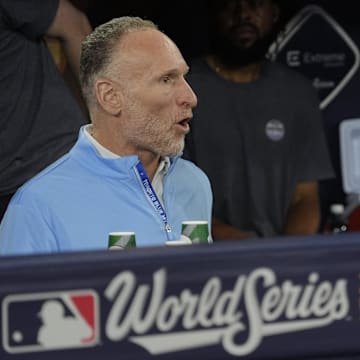 Toronto Blue Jays President and CEO Mark Shapiro and Executive Vice President, Baseball Operations and General Manager Ross Atkins speak in the dugout before game one of the World Series at Rogers Centre.
