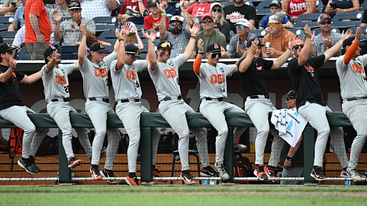 Jun 17, 2025; Omaha, Neb, USA; The Oregon State Beavers bench cheer action against the Louisville Cardinals during the eighth inning at Charles Schwab Field. Mandatory Credit: Steven Branscombe-Imagn Images Jun 17, 2025; Omaha, Neb, USA; The Oregon State Beavers bench cheer action against the Louisville Cardinals during the eighth inning at Charles Schwab Field. Mandatory Credit: Steven Branscombe-Imagn Images