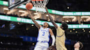Mar 13, 2025; Charlotte, NC, USA; Duke Blue Devils guard Isaiah Evans (3) goes to the basket against Georgia Tech Yellow Jackets forward Baye Ndongo (11) during the second half at Spectrum Center.