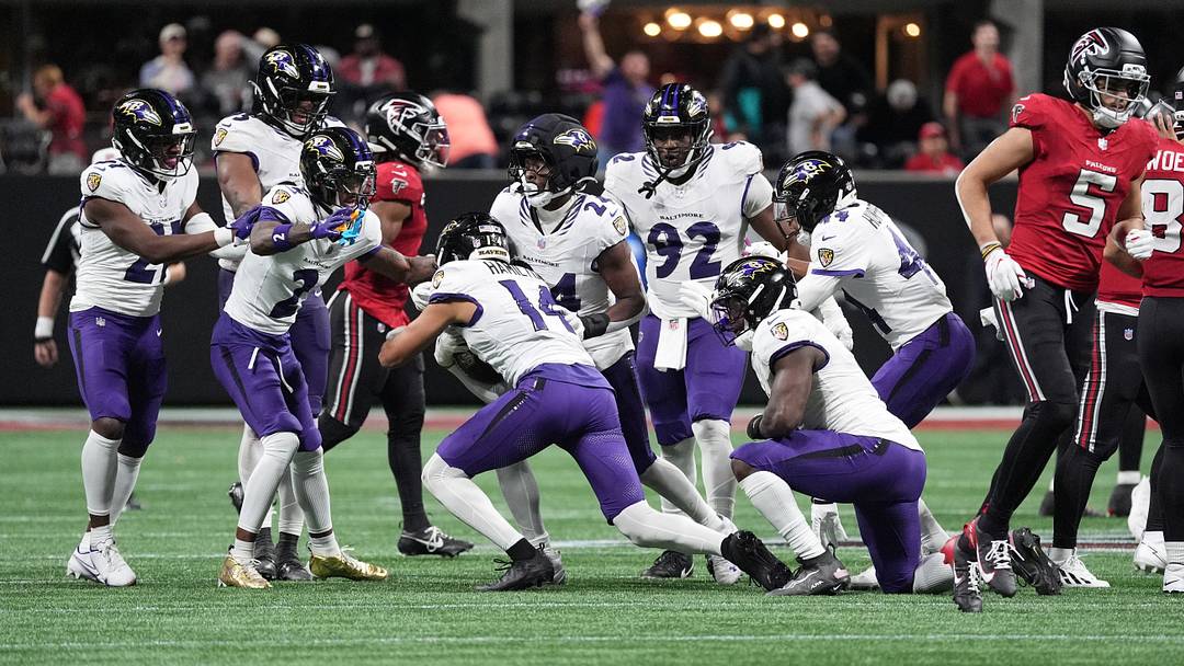 Oct 11, 2026; Atlanta, Georgia, USA; Baltimore Ravens safety Kyle Hamilton (14) celebrates with teammates after making an interception to end the game in overtime against the Atlanta Falcons at Mercedes-Benz Stadium. Mandatory Credit: Dale Zanine-Imagn Images Oct 11, 2026; Atlanta, Georgia, USA; Baltimore Ravens safety Kyle Hamilton (14) celebrates with teammates after making an interception to end the game in overtime against the Atlanta Falcons at Mercedes-Benz Stadium. Mandatory Credit: Dale Zanine-Imagn Images