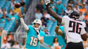 Aug 9, 2024; Miami Gardens, Florida, USA; Miami Dolphins quarterback Skylar Thompson (19) passes the football as Atlanta Falcons defensive end Zach Harrison (96) defends during the first quarter at Hard Rock Stadium. Mandatory Credit: Sam Navarro-USA TODAY Sports