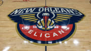 Apr 12, 2023; New Orleans, Louisiana, USA; Detailed view of the New Orleans Pelicans logo at mid court before the Play-In game against the Oklahoma City Thunder at Smoothie King Center