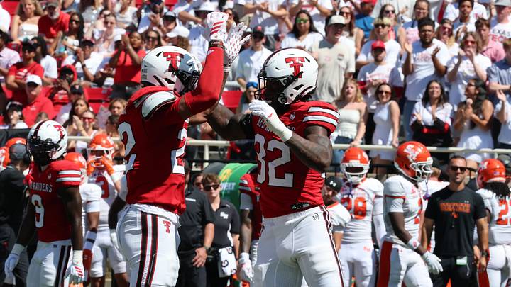 Sep 26, 2026; Lubbock, Texas, USA;  Texas Tech Red Raiders defensive safety Marcus Ramon-Edwards (22) and  defensive end LaDamion Guyton (32) react after a play against the Sam Houston Bearkats in the second half at Galaxy Stadium.  Mandatory Credit: Michael C. Johnson-Imagn Images