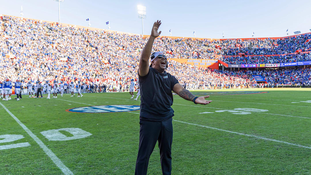 Nov 23, 2024; Gainesville, Florida, USA; Florida Gators associate head coach for running backs Jabbar Juluke celebrates after a game against the Mississippi Rebels at Ben Hill Griffin Stadium. Mandatory Credit: Matt Pendleton-Imagn Images