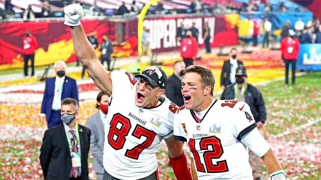 Feb 7, 2021; Tampa, FL, USA;  Tampa Bay Buccaneers quarterback Tom Brady (12) and tight end Rob Gronkowski (87) celebrate after beating the Kansas City Chiefs in Super Bowl LV at Raymond James Stadium.  Mandatory Credit: Mark J. Rebilas-Imagn Images