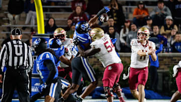 Oct 18, 2024; Durham, North Carolina, USA;  Duke Blue Devils defensive end Vincent Anthony Jr. (7) blocks Florida State Seminoles quarterback Brock Glenn (11) throw during the first half of the game at Wallace Wade Stadium. Mandatory Credit: Jaylynn Nash-Imagn Images