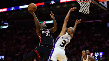 Nov 4, 2024; Miami, Florida, USA; Miami Heat forward Jimmy Butler (22) drives to the basket against Sacramento Kings guard Jordan McLaughlin (3) during the second quarter at Kaseya Center. Mandatory Credit: Sam Navarro-Imagn Images