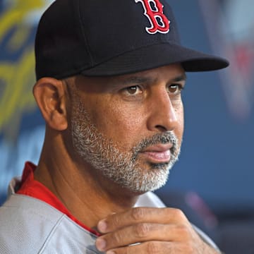 Jul 21, 2025; Philadelphia, Pennsylvania, USA; Boston Red Sox manager Alex Cora (13) in the dugout against the Philadelphia Phillies at Citizens Bank Park. Mandatory Credit: Eric Hartline-Imagn Images