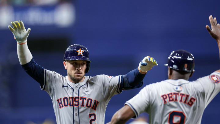 Houston Astros third baseman Alex Bregman (2) is congratulated by third base coach Gary Pettis (8) after hitting a home run against the Tampa Bay Rays in the fifth inning at Tropicana Field on Aug 13.