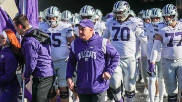 Nov 19, 2022; Morgantown, West Virginia, USA; Kansas State Wildcats head coach Chris Klieman leads his team onto the field prior to their game against the West Virginia Mountaineers at Mountaineer Field at Milan Puskar Stadium. Mandatory Credit: Ben Queen-USA TODAY Sports