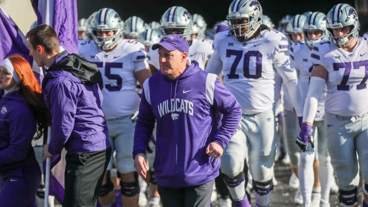 Nov 19, 2022; Morgantown, West Virginia, USA; Kansas State Wildcats head coach Chris Klieman leads his team onto the field prior to their game against the West Virginia Mountaineers at Mountaineer Field at Milan Puskar Stadium. Mandatory Credit: Ben Queen-USA TODAY Sports