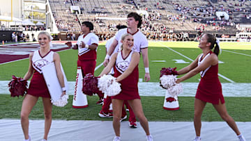 Oct 26, 2024; Starkville, Mississippi, USA; Arkansas Razorbacks cheerleaders cheer during the fourth quarter against the Mississippi State Bulldogs at Davis Wade Stadium at Scott Field. Mandatory Credit: Matt Bush-Imagn Images