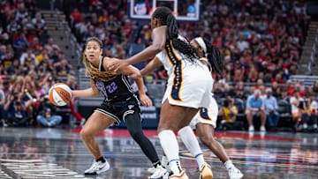 Jul 9, 2025; Indianapolis, Indiana, USA; Golden State Valkyries guard Veronica Burton (22) dribbles shoots the ball while Indiana Fever forward Aliyah Boston (7) defends in the second half at Gainbridge Fieldhouse. Mandatory Credit: Trevor Ruszkowski-Imagn Images