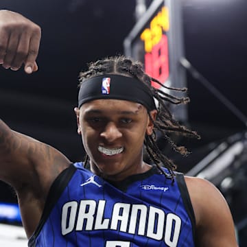 Apr 15, 2025; Orlando, Florida, USA; Orlando Magic forward Paolo Banchero (5) reacts after basket against the Atlanta Hawks in the fourth quarter at Kia Center. Mandatory Credit: Nathan Ray Seebeck-Imagn Images