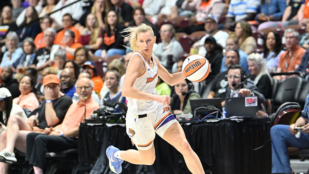 Jun 18, 2025; Uncasville, Connecticut, USA; Phoenix Mercury guard Lexi Held (1) dribbles the ball against the Connecticut Sun during the second half at Mohegan Sun Arena. Mandatory Credit: Eric Canha-Imagn Images