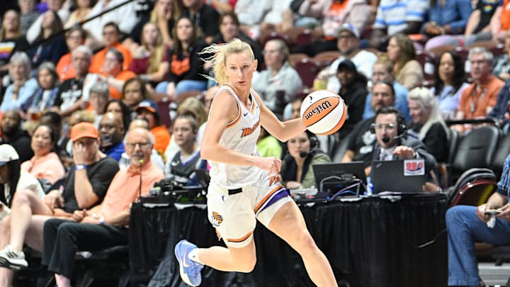 Jun 18, 2025; Uncasville, Connecticut, USA; Phoenix Mercury guard Lexi Held (1) dribbles the ball against the Connecticut Sun during the second half at Mohegan Sun Arena. Mandatory Credit: Eric Canha-Imagn Images