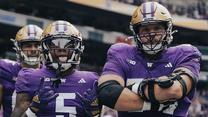 Giles Jackson and Enokk Vimahi share an Apple Cup moment. 