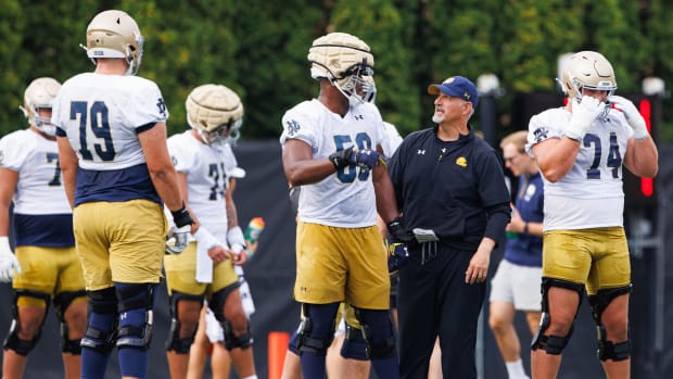 Notre Dame offensive line coach Joe Rudolph leads his unit during fall camp