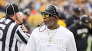 Nov 8, 2025; Morgantown, West Virginia, USA; Colorado Buffaloes head coach Deion Sanders walks along the sidelines late in the fourth quarter against the West Virginia Mountaineers at Milan Puskar Stadium. Mandatory Credit: Ben Queen-Imagn Images