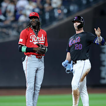 Sep 6, 2024; New York City, New York, USA; New York Mets first baseman Pete Alonso (20) and Cincinnati Reds shortstop Elly De La Cruz (44) react after Alonso hit a double during the sixth inning at Citi Field. Mandatory Credit: Brad Penner-Imagn Images