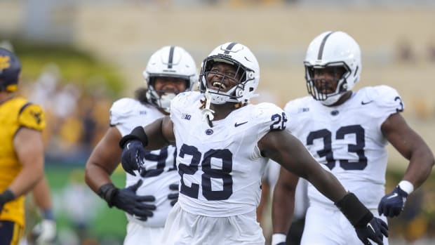 Penn State's defense celebrates following another tackle for loss vs. West Virginia