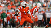 Dec 28, 2024; Orlando, FL, USA; Miami Hurricanes quarterback Cam Ward (1) drops back to pass against the Iowa State Cyclones in the first quarter during the Pop Tarts bowl at Camping World Stadium. Mandatory Credit: Nathan Ray Seebeck-Imagn Images