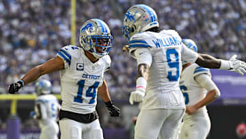 Oct 20, 2024; Minneapolis, Minnesota, USA; Detroit Lions wide receiver Amon-Ra St. Brown (14) reacts with wide receiver Jameson Williams (9) after catching a 35 yard touchdown pass from quarterback Jared Goff (not pictured) against the Minnesota Vikings the second quarter at U.S. Bank Stadium. Mandatory Credit: Jeffrey Becker-Imagn Images