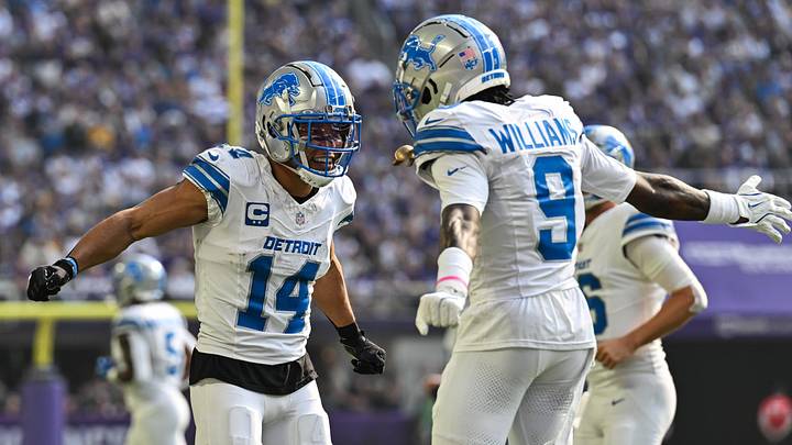 Oct 20, 2024; Minneapolis, Minnesota, USA; Detroit Lions wide receiver Amon-Ra St. Brown (14) reacts with wide receiver Jameson Williams (9) after catching a 35 yard touchdown pass from quarterback Jared Goff (not pictured) against the Minnesota Vikings the second quarter at U.S. Bank Stadium. Mandatory Credit: Jeffrey Becker-Imagn Images