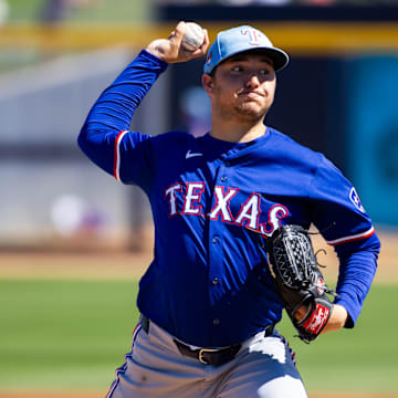 Mar 5, 2024; Peoria, Arizona, USA; Texas Rangers pitcher Owen White against the Seattle Mariners during a spring training baseball game at Peoria Sports Complex. 