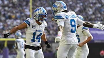 Oct 20, 2024; Minneapolis, Minnesota, USA; Detroit Lions wide receiver Amon-Ra St. Brown (14) reacts with wide receiver Jameson Williams (9) after catching a 35 yard touchdown pass from quarterback Jared Goff (not pictured) against the Minnesota Vikings the second quarter at U.S. Bank Stadium. Mandatory Credit: Jeffrey Becker-Imagn Images