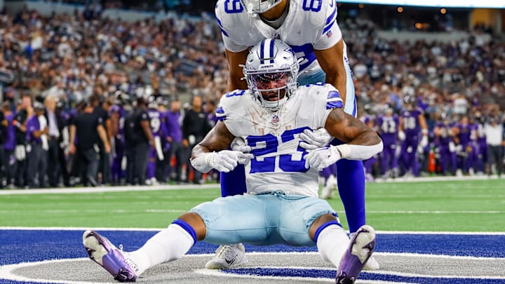 Dallas Cowboys running back Rico Dowdle is helped during the fourth quarter against the Baltimore Ravens.