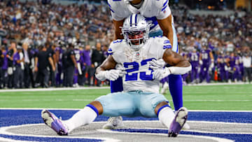 Sep 22, 2024; Arlington, Texas, USA; Dallas Cowboys running back Rico Dowdle (23) is helped up by tight end Brevyn Spann-Ford (89) during the fourth quarter against the Baltimore Ravens at AT&T Stadium. Mandatory Credit: Andrew Dieb-Imagn Images