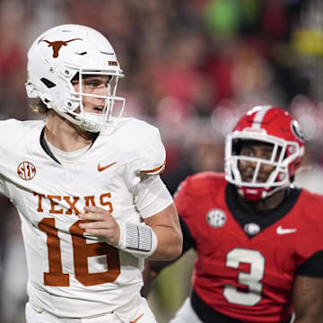 Texas Longhorns quarterback Arch Manning looks to make a pass during the first half against the Georgia Bulldogs at Sanford Stadium in Athens, Georgia.