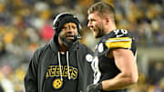 Nov 30, 2025; Pittsburgh, Pennsylvania, USA; Pittsburgh Steelers head coach Mike Tomlin speaks with Pittsburgh Steelers linebacker T.J. Watt (90) during the second quarter against the Buffalo Bills at Acrisure Stadium. Mandatory Credit: Barry Reeger-Imagn Images